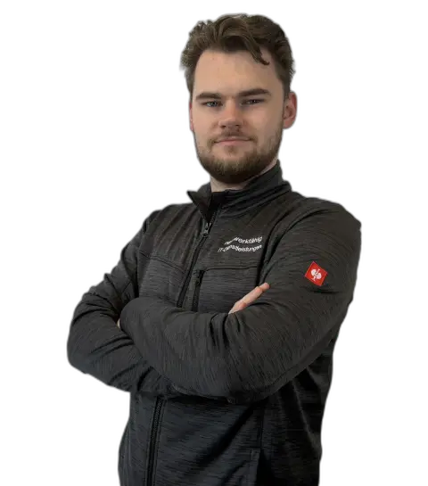 Porträtfoto von Nick Jansen in einer dunklen Outdoor-Jacke mit verschränkten Armen.